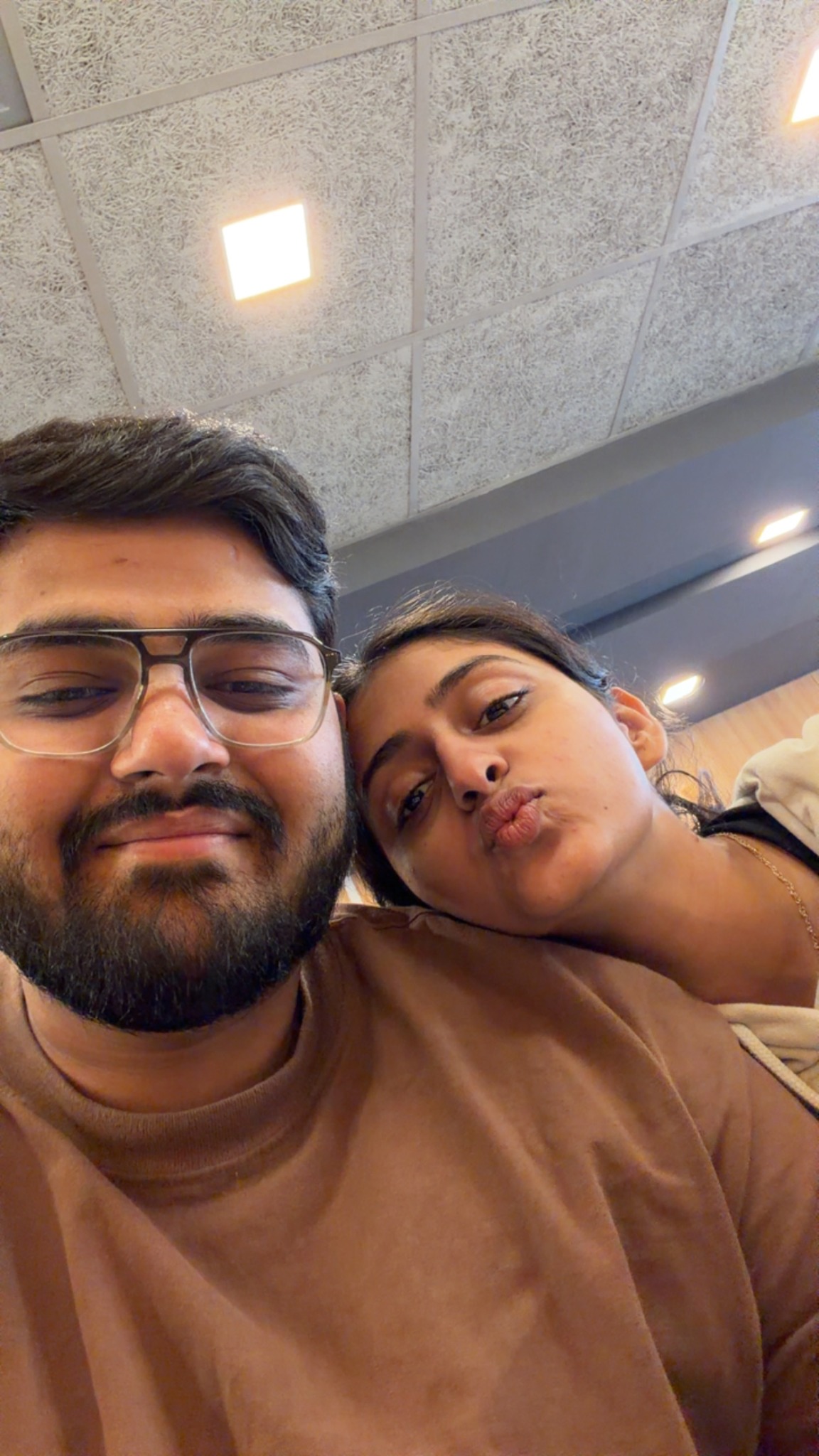 Dev and Dhimahi sharing a close-up selfie